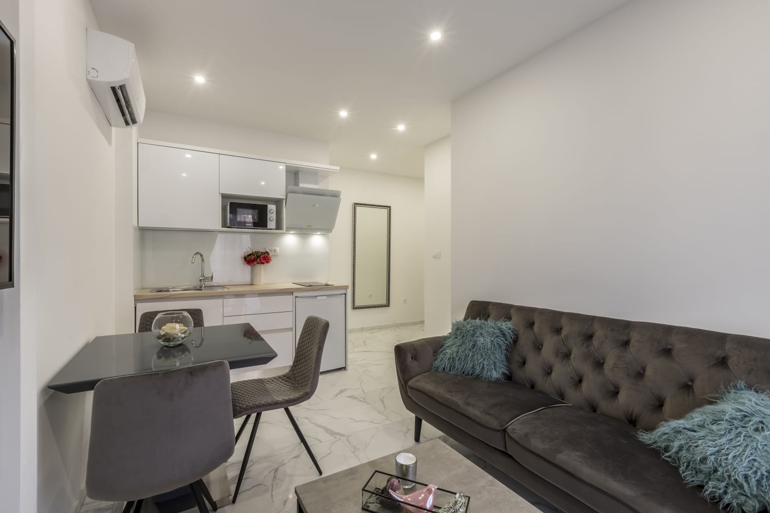 Living room with sofa and kitchen